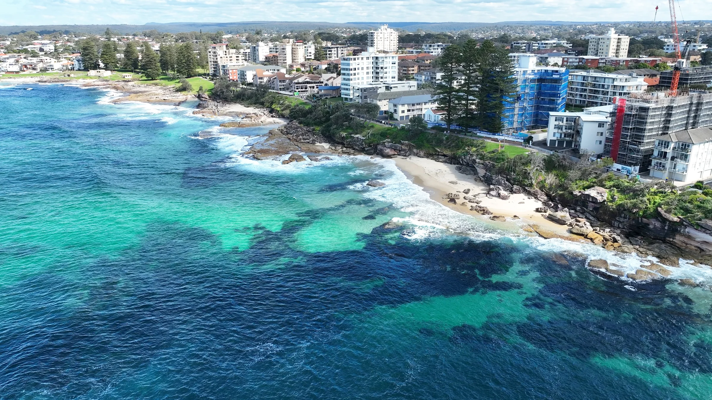 Aerial view along the Cronulla coast with Blackwoods Beach and reef beneath the water