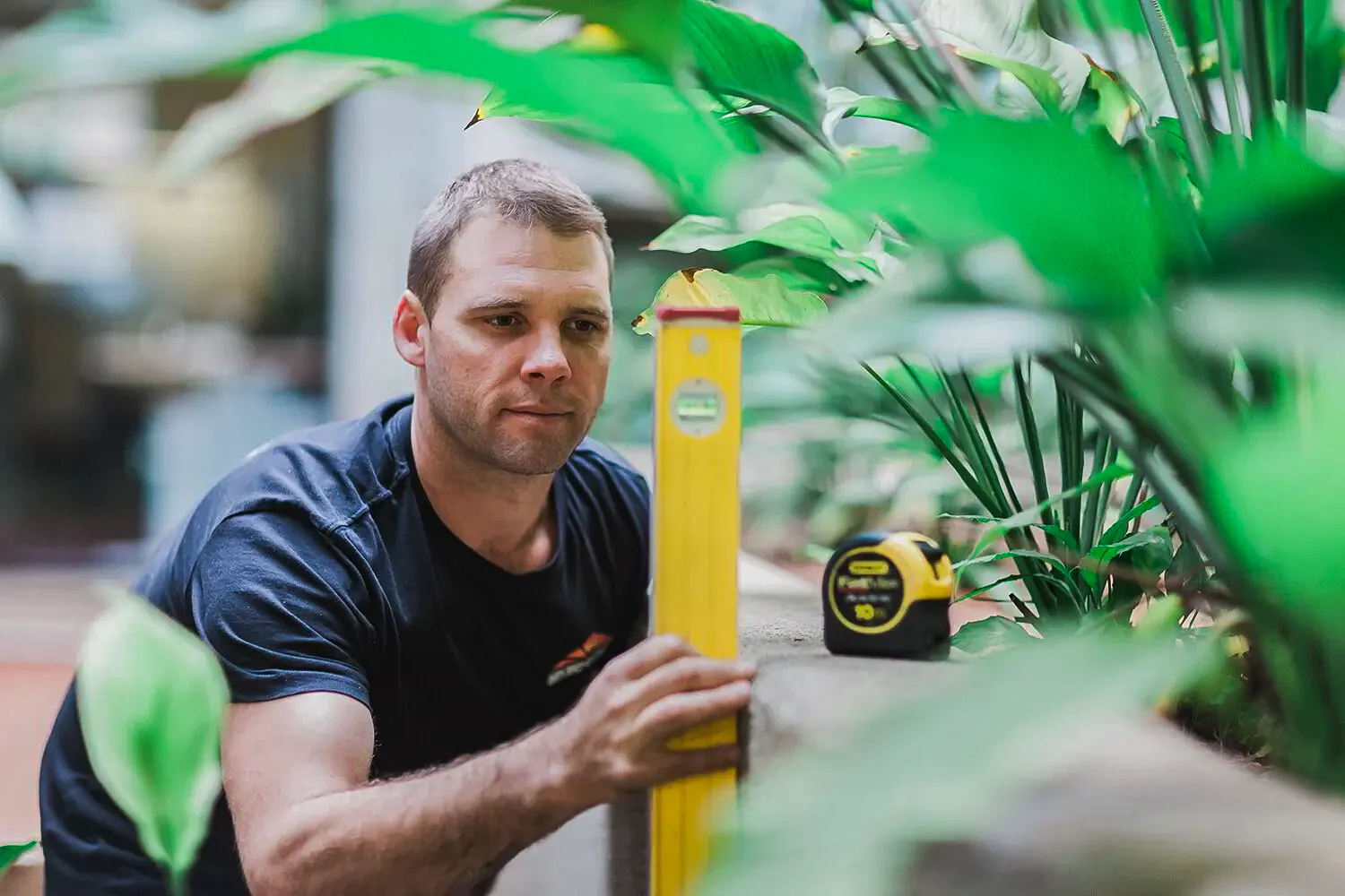 Tradesman checking his work with a spirit level