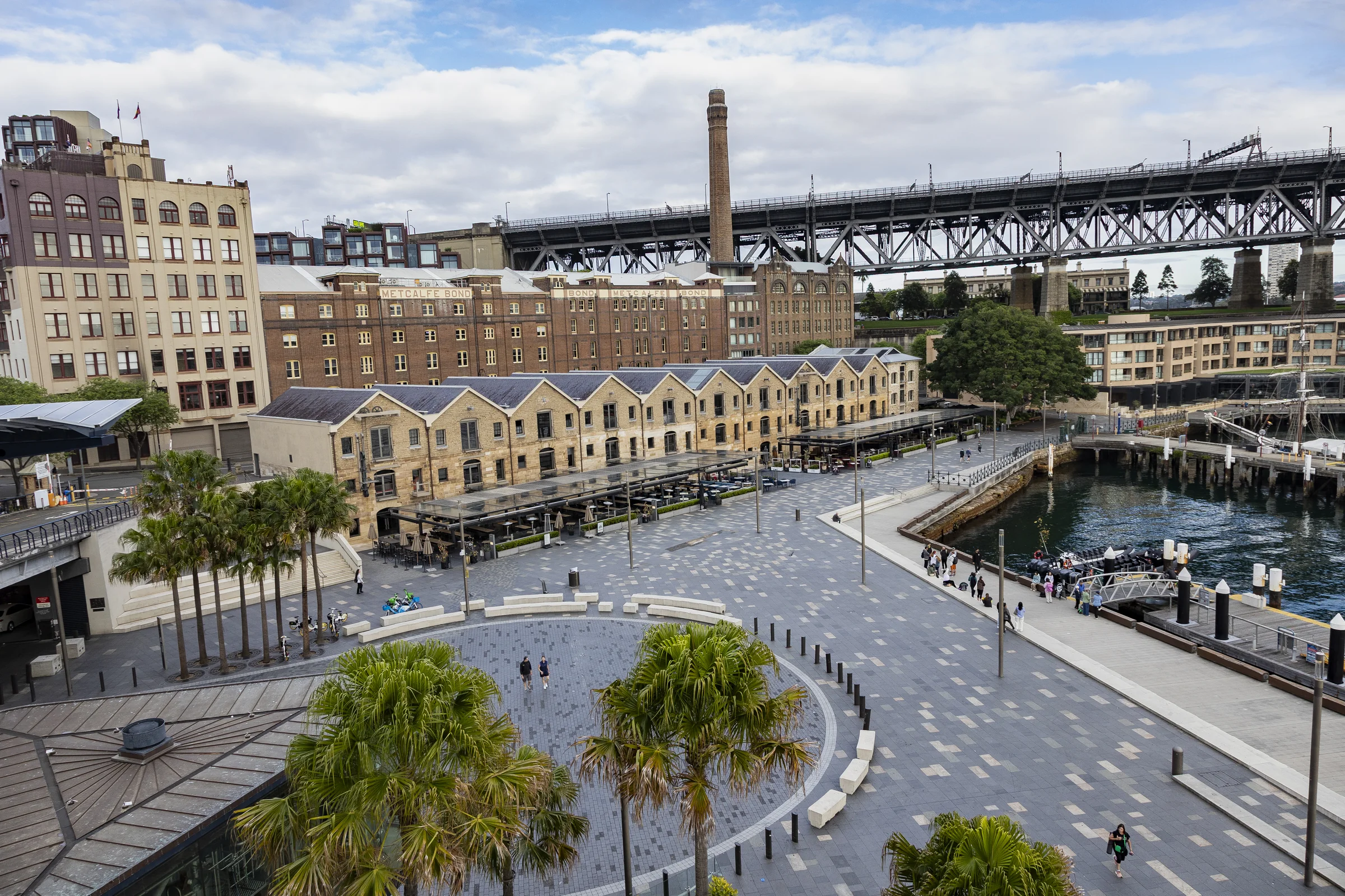 Elevated view of Campbells Cove, its waterfront buildings and the Harbour Bridge