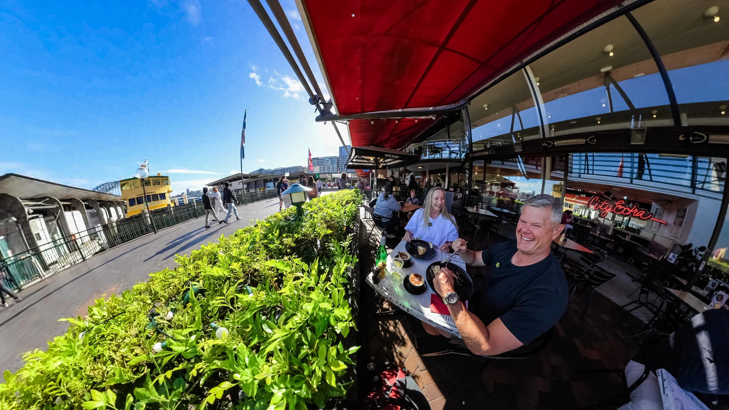 Rob and Sue sitting together at City Extra beside Circular Quay