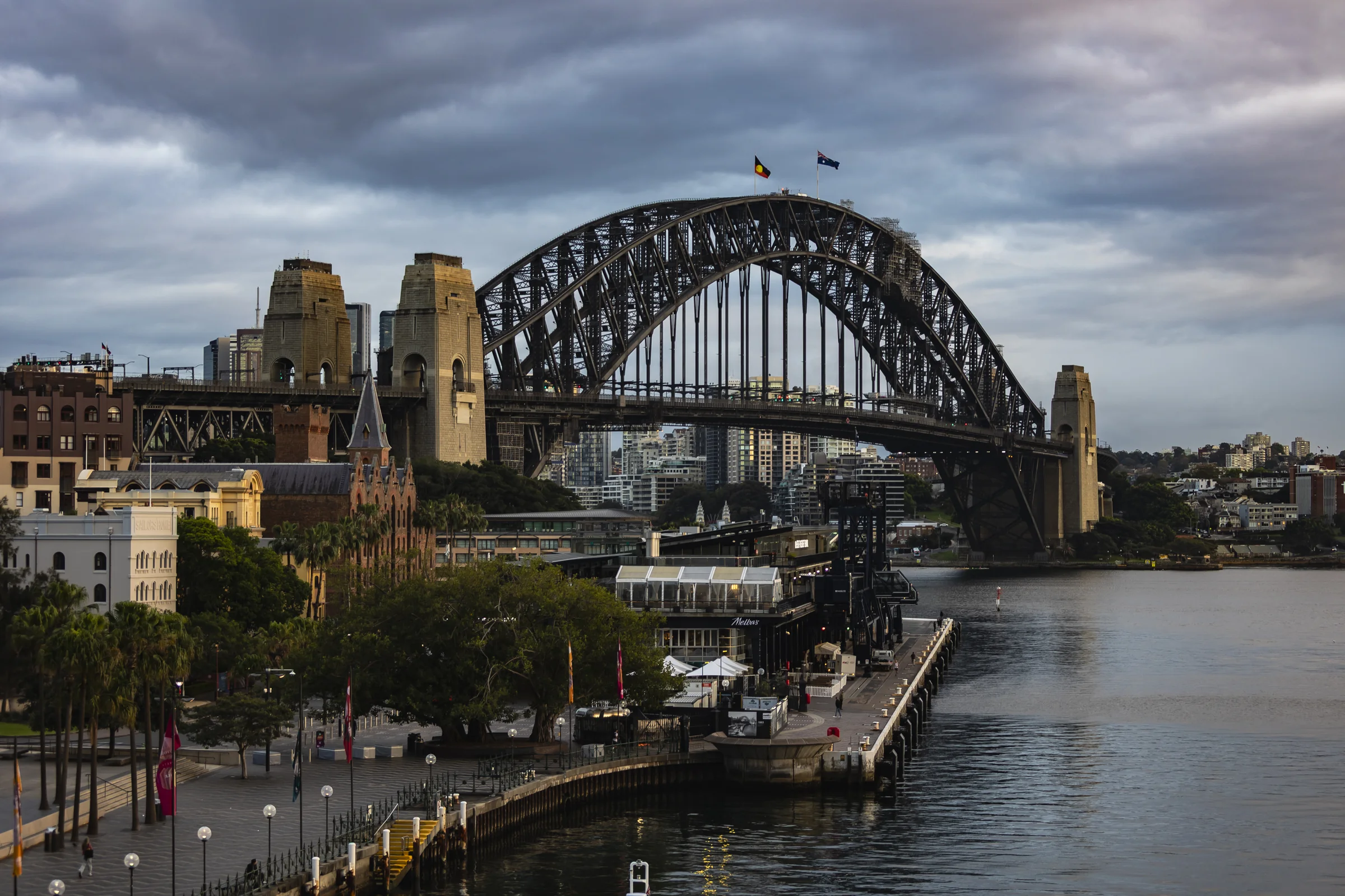 Sydney Harbour Bridge and waterfront buildings seen across Circular Quay