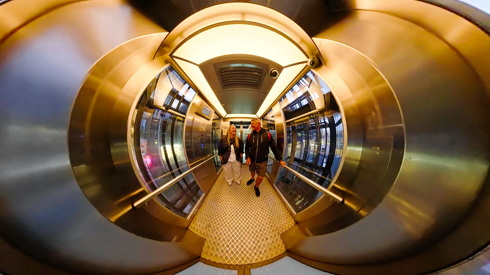 Another curved view of the lift interior and reflections