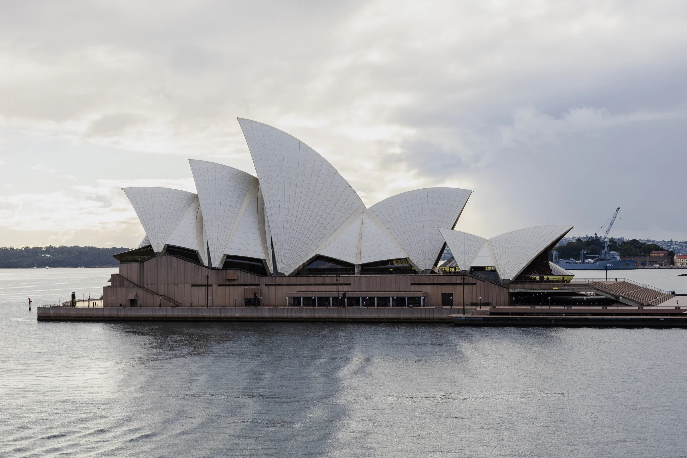 Clear view of the Sydney Opera House sails and waterfront across the harbour