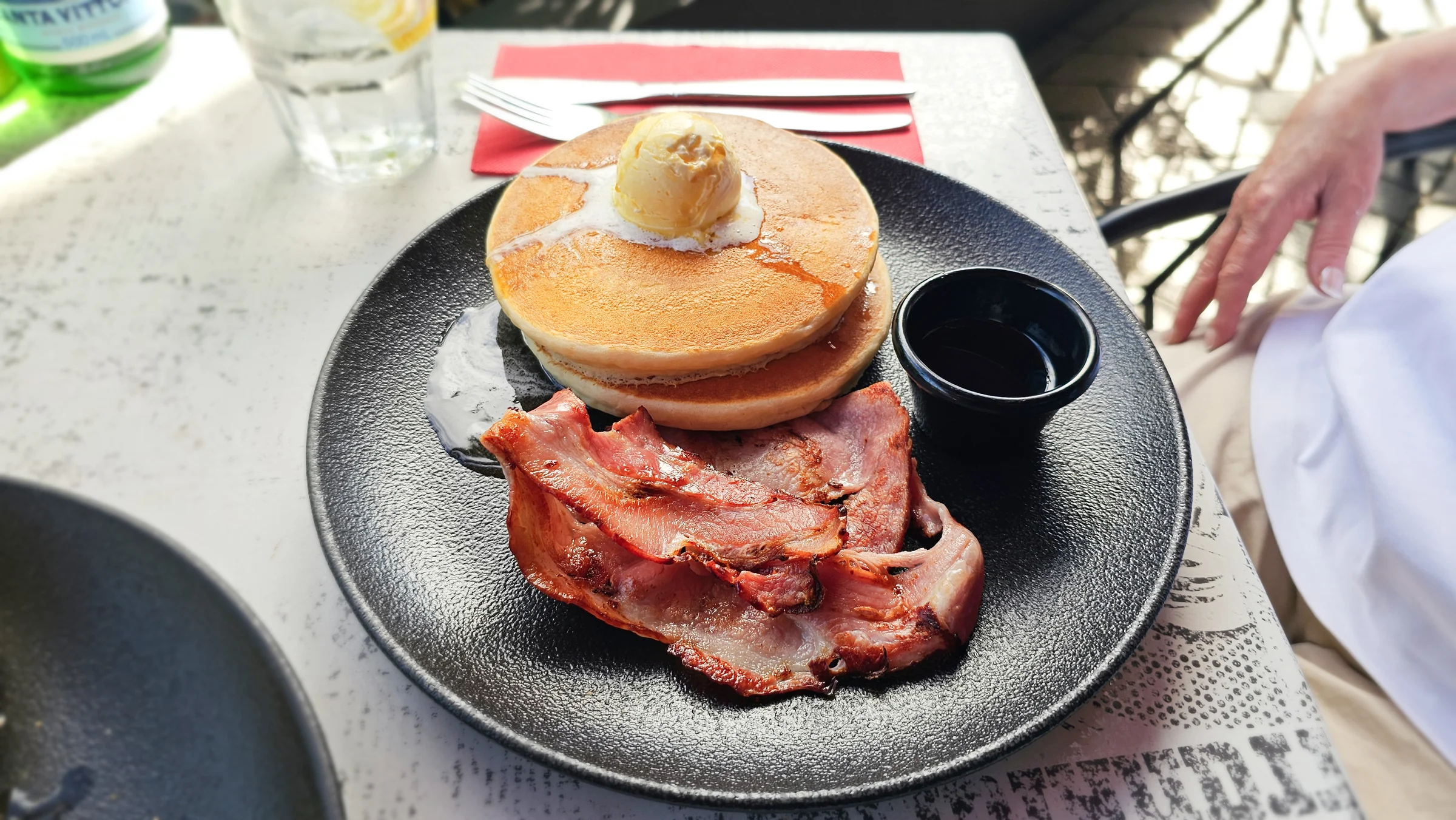 Closer view of Sue’s pancakes, bacon and eggs at City Extra