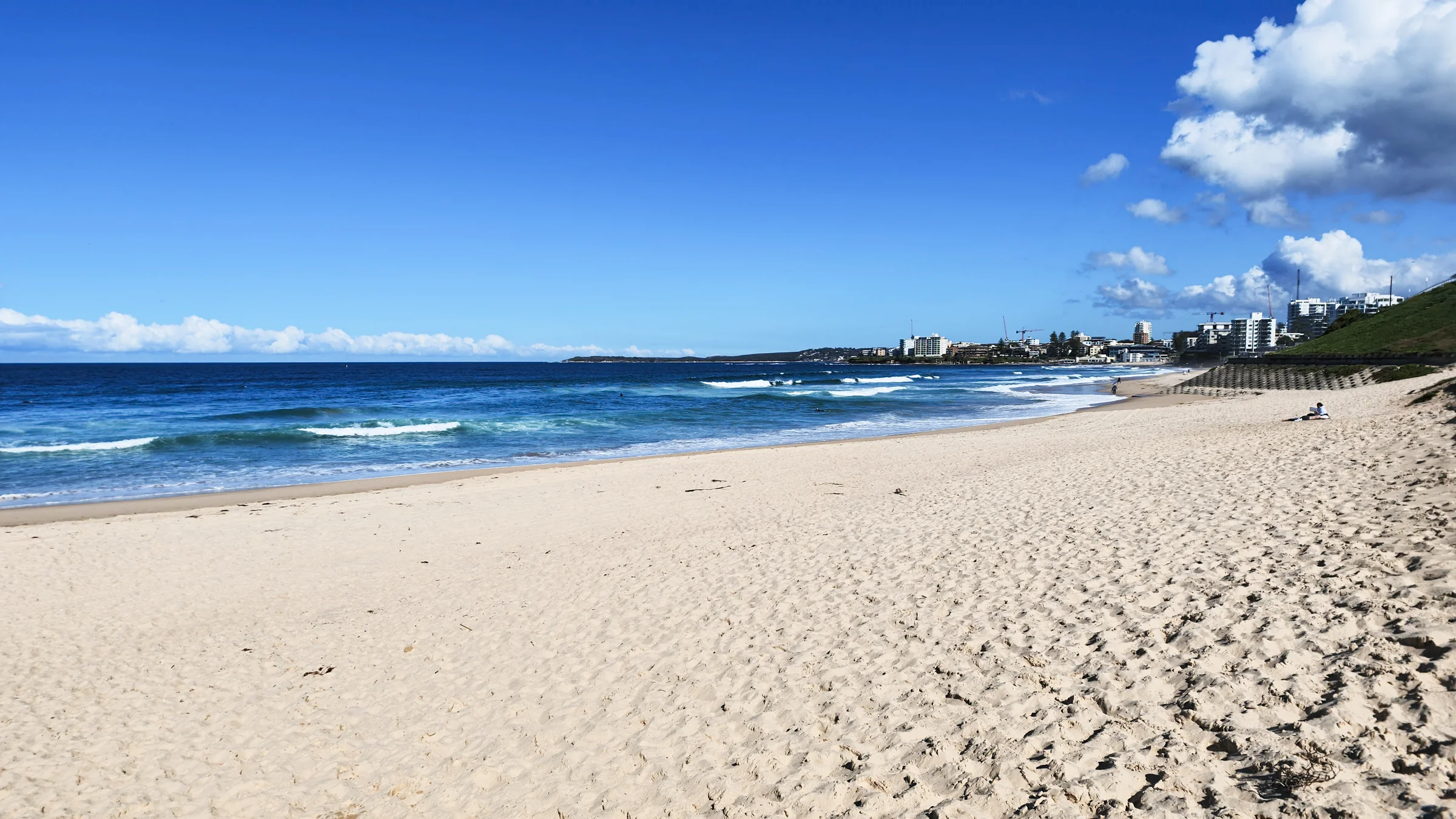 View south along Elouera Beach towards North Cronulla and its beachfront buildings