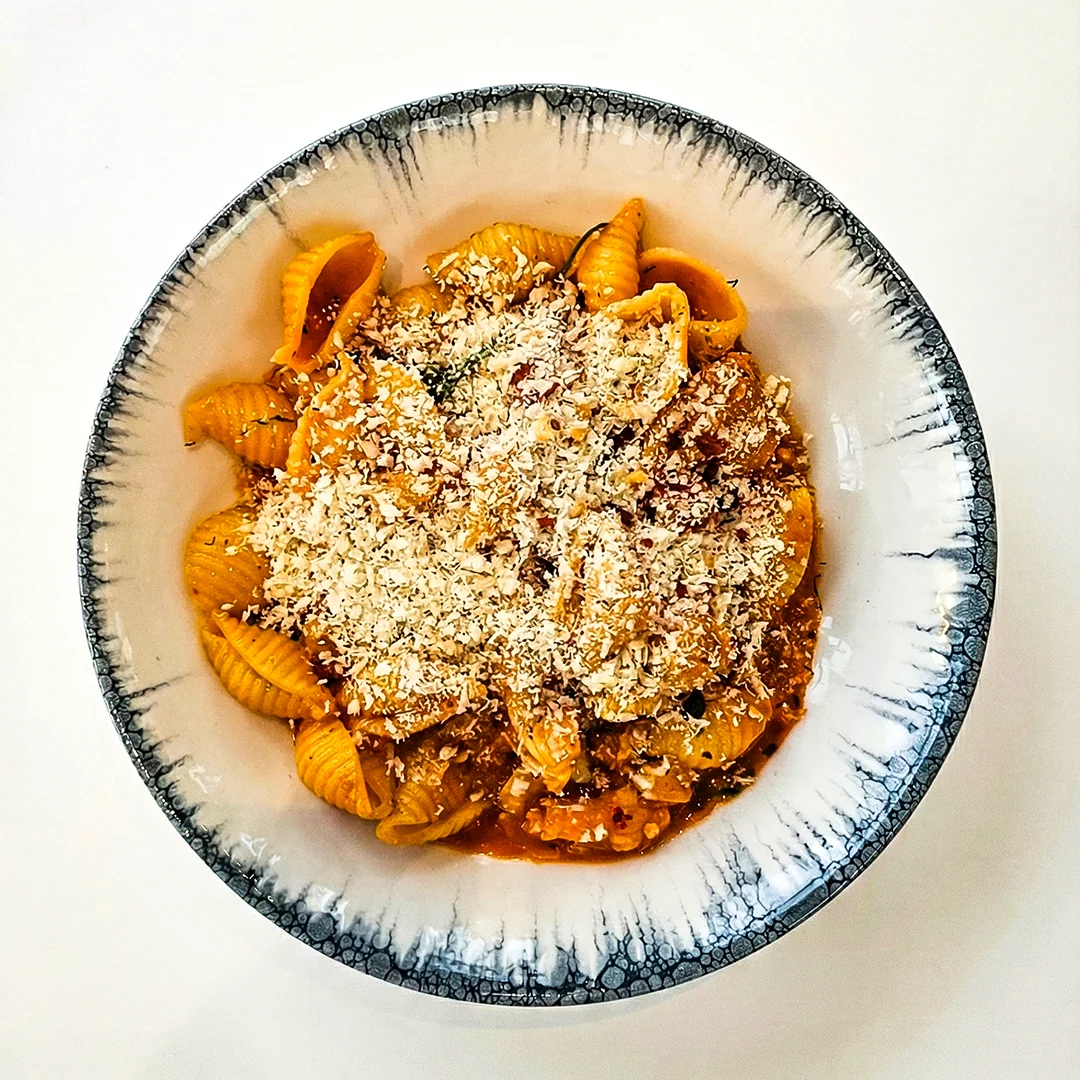 Pasta topped with grated cheese