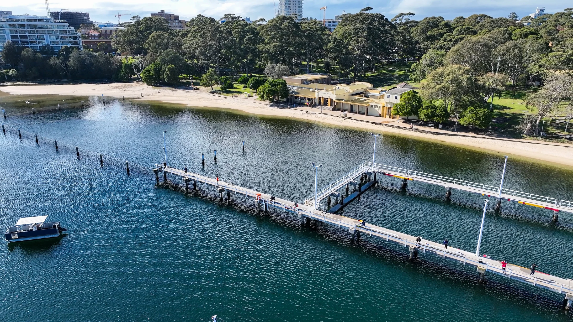 Aerial view of the Gunnamatta baths boardwalk and swimmers