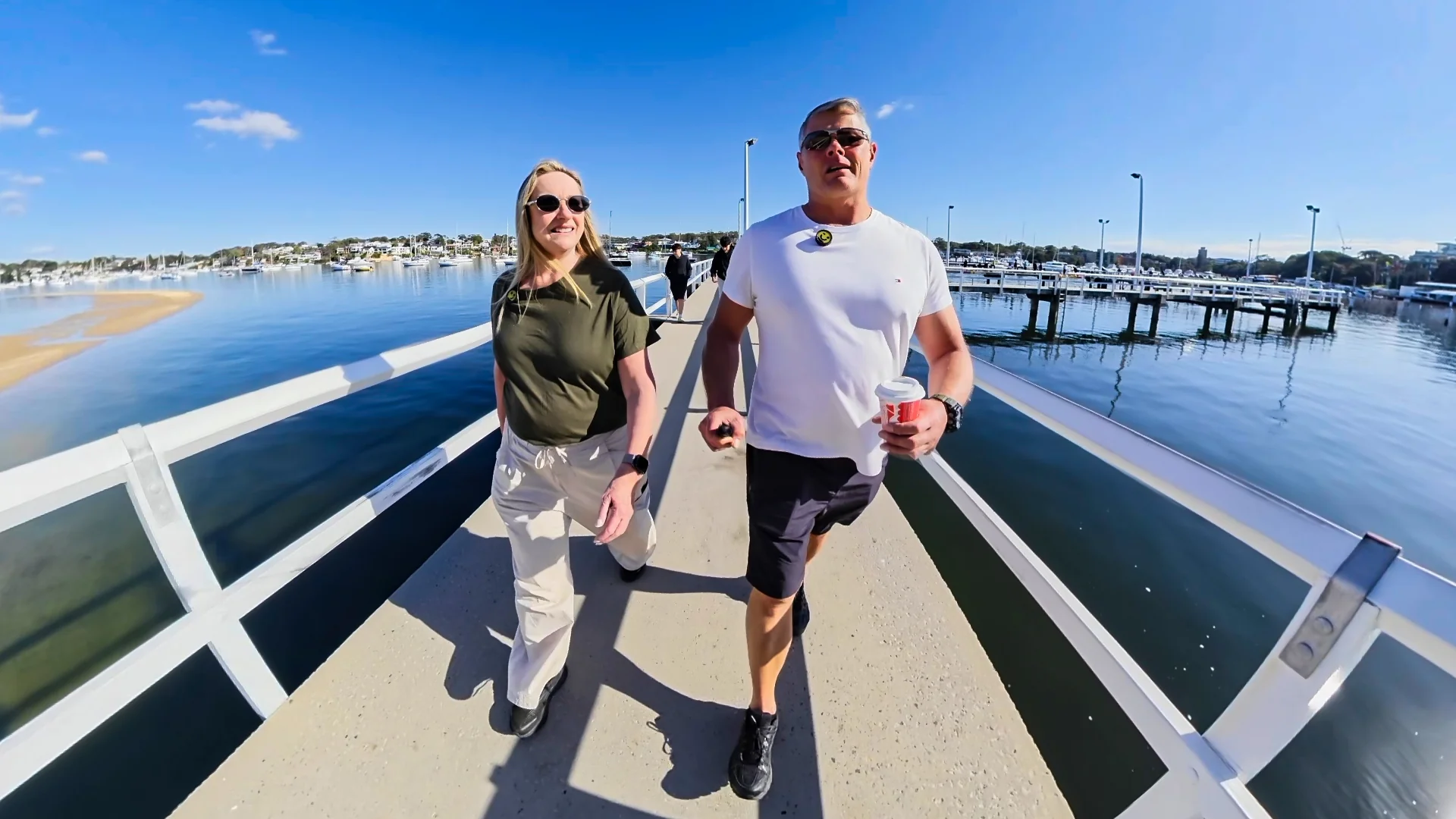 Rob and Sue walking on the Gunnamatta Bay boardwalk