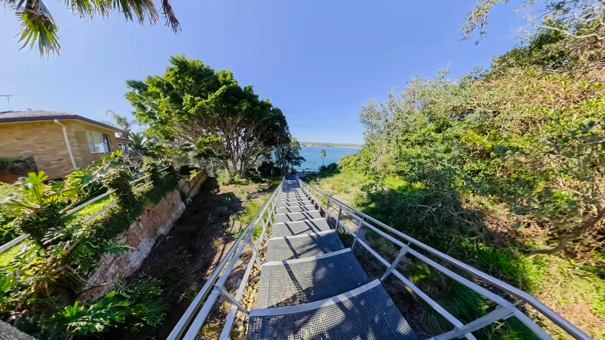 Stairs with handrails leading down towards the Hungry Point walkway