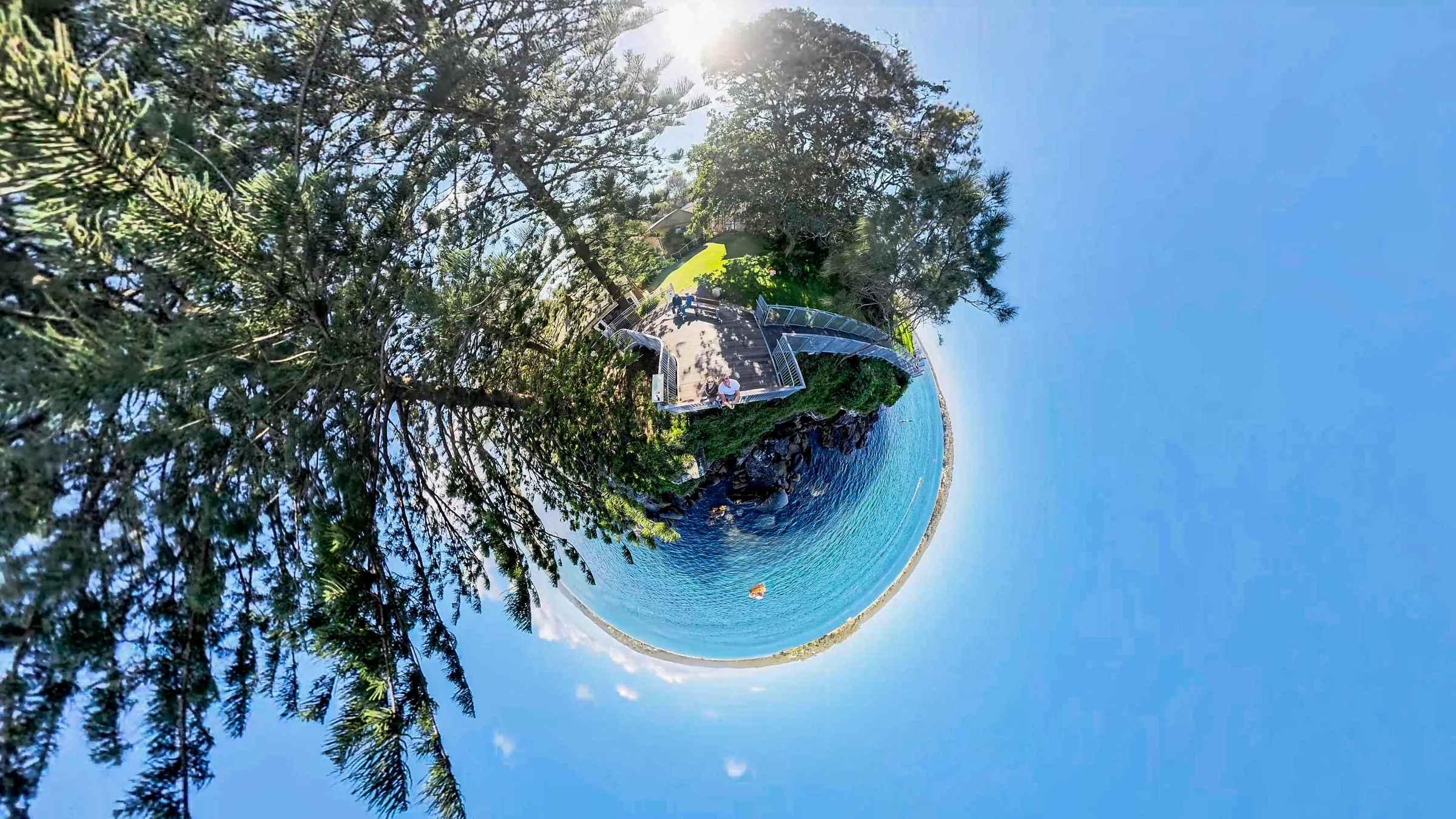 Tiny-planet photograph of the trees, sky and water at Hungry Point