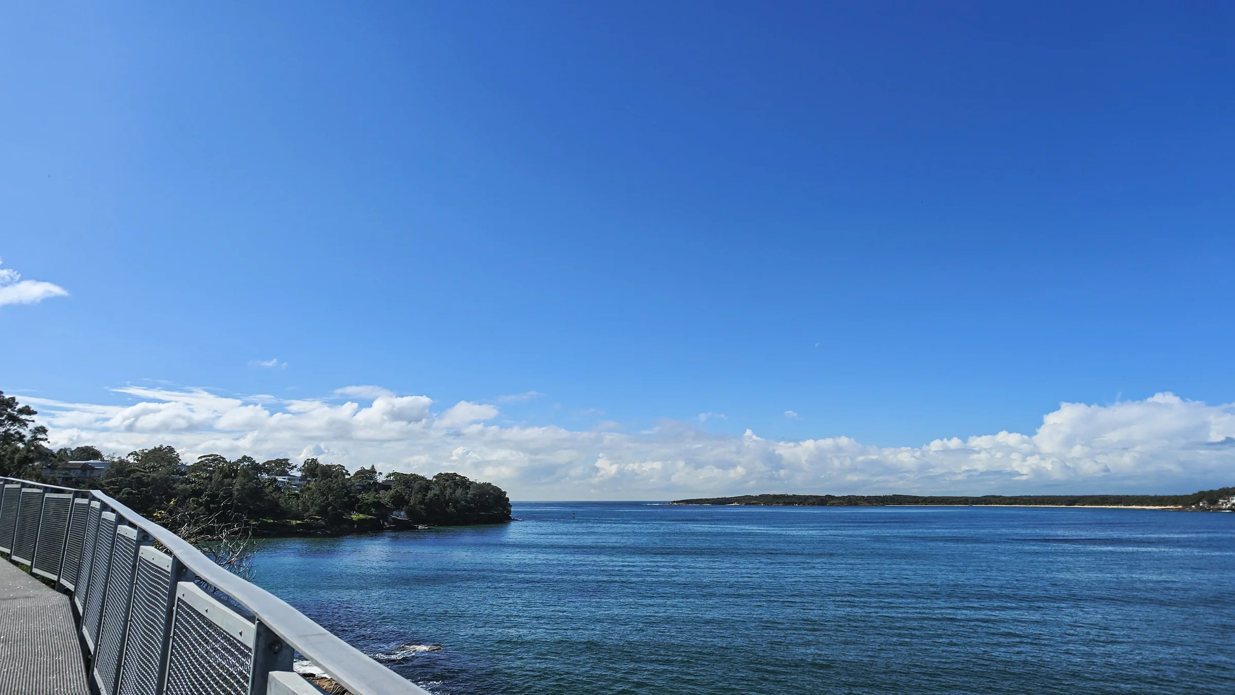 View from the walkway over open water and the opposite shore