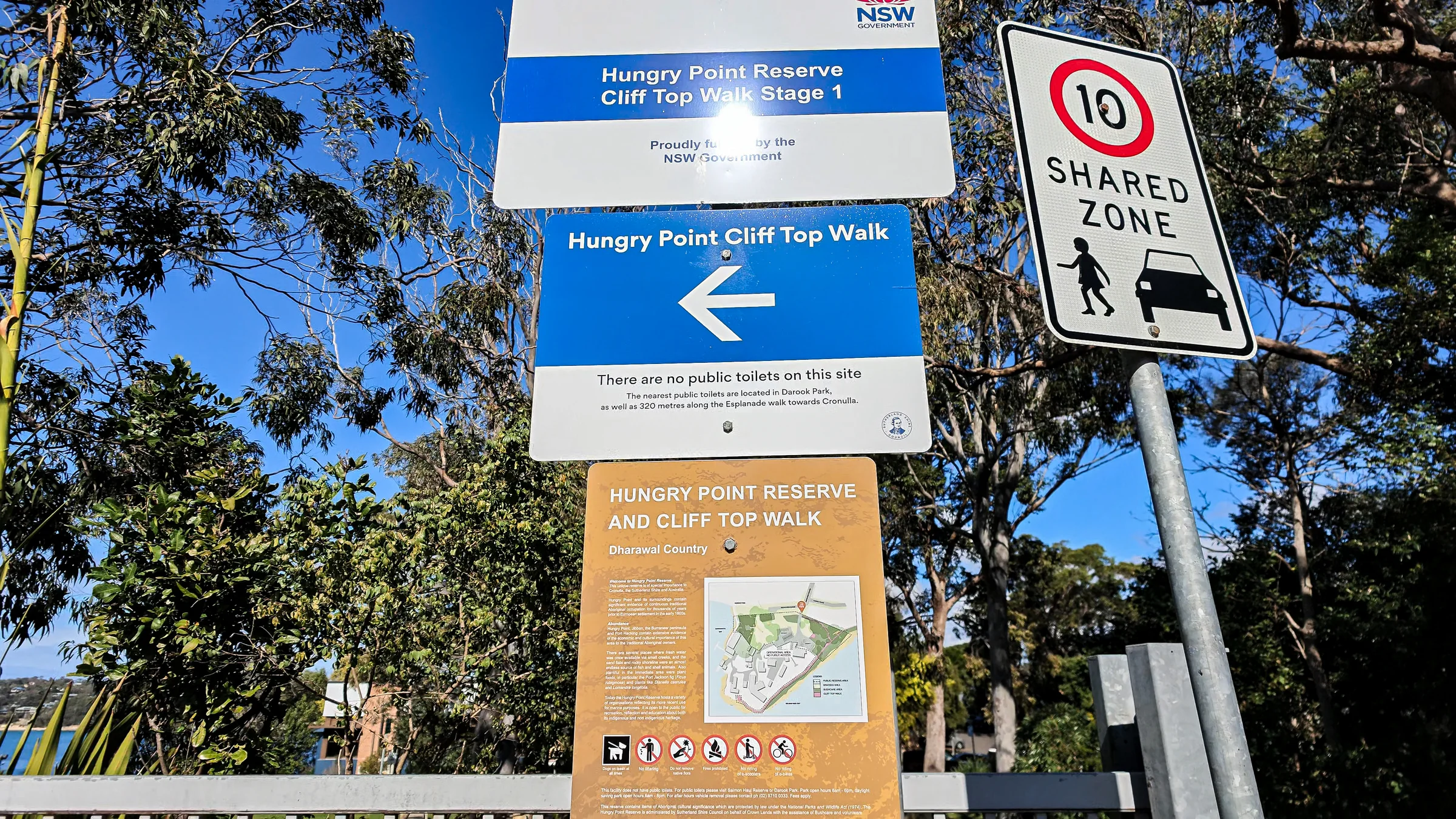 Hungry Point Reserve and Cliff Top Walk signs beside trees