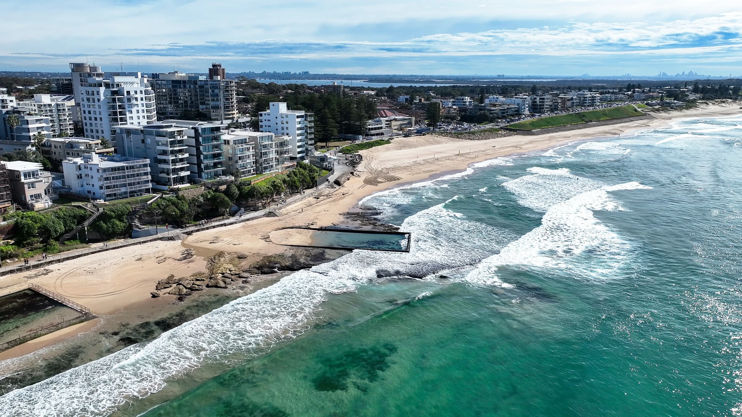 Cronulla ocean pools on the rocky foreshore with North Cronulla Beach beyond