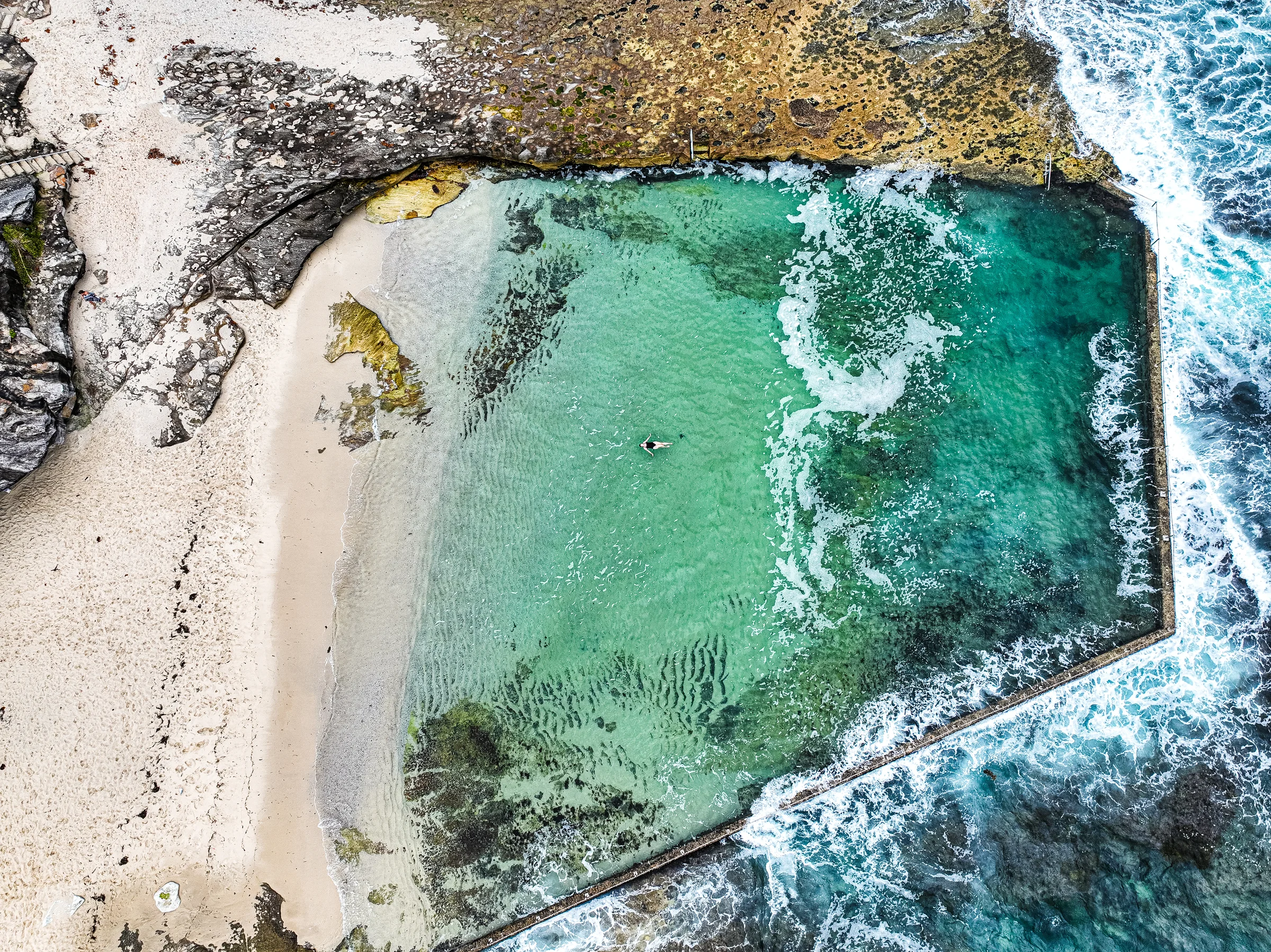 Oak Park ocean pool and adjacent beach seen from directly above