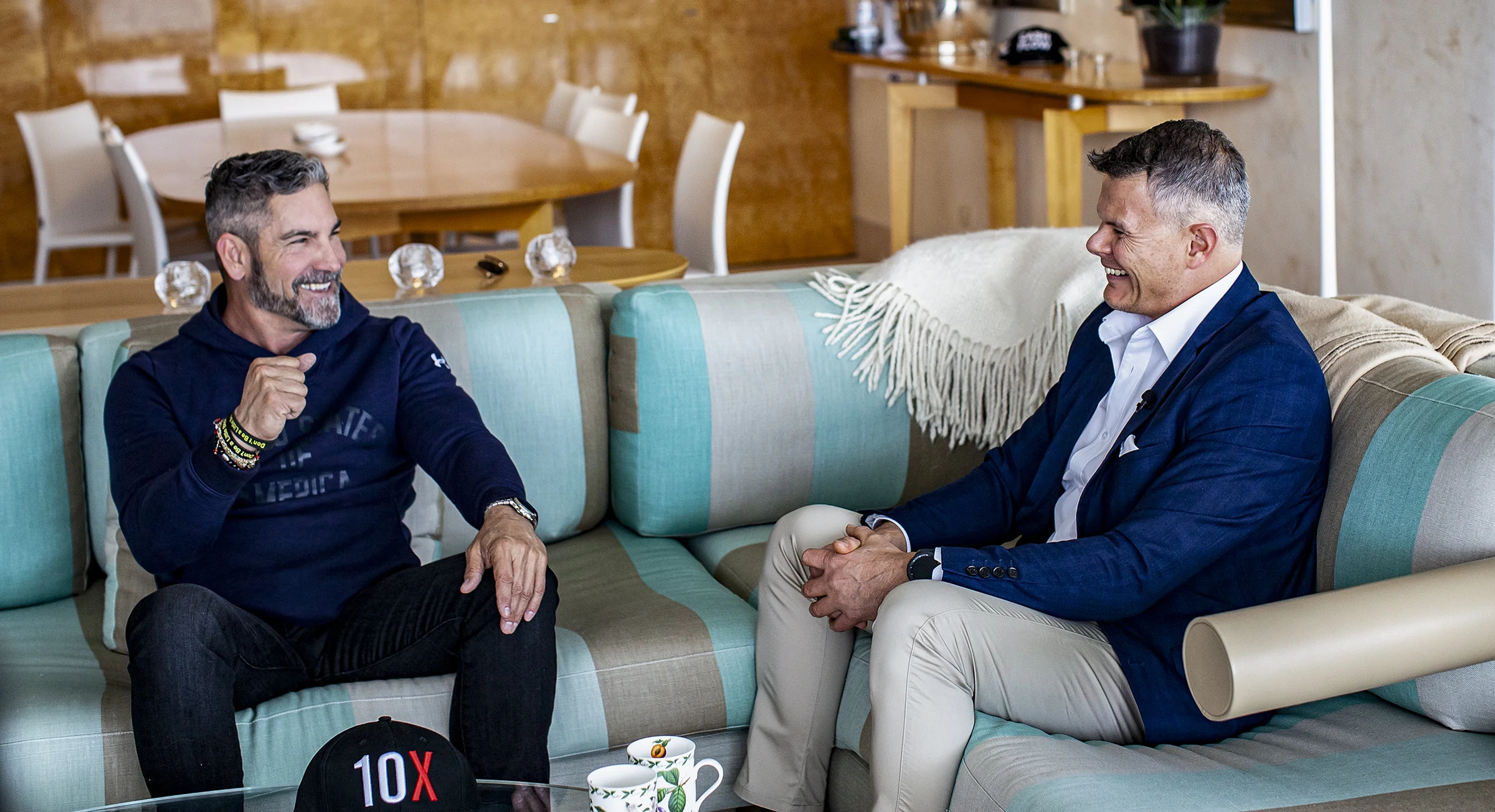 Rob interviewing Grant Cardone, both smiling during their conversation