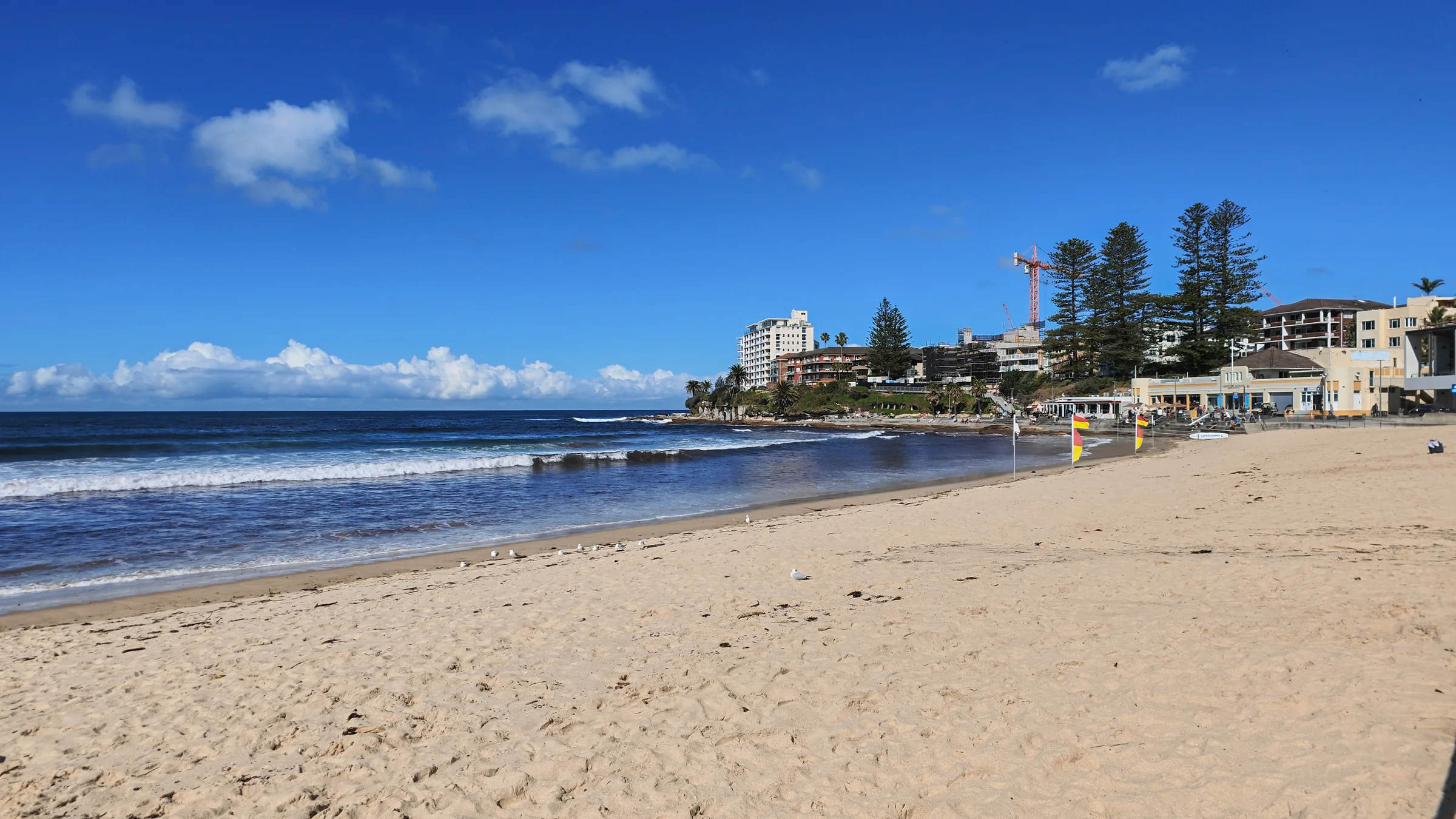 South Cronulla sand and surf looking towards the pavilion and surf club