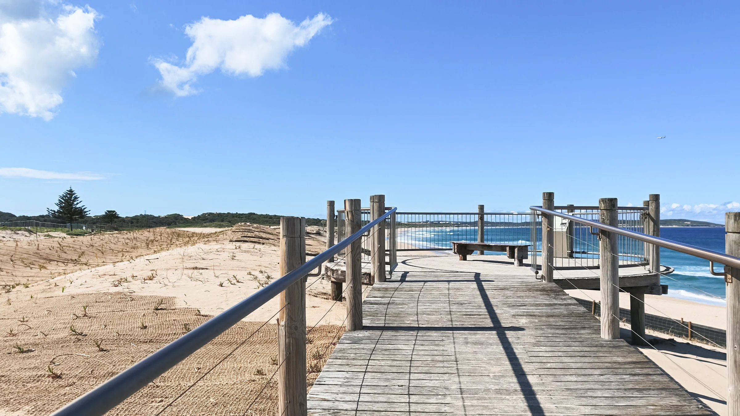 Boardwalk through the sand dunes leading to Wanda Beach