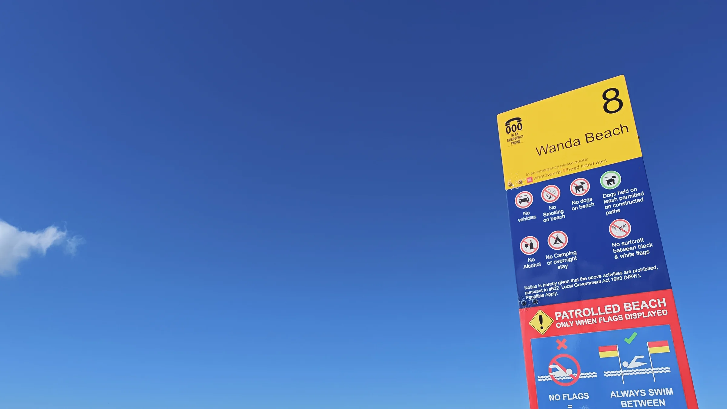 Wanda Beach access sign with swimming and surf safety information