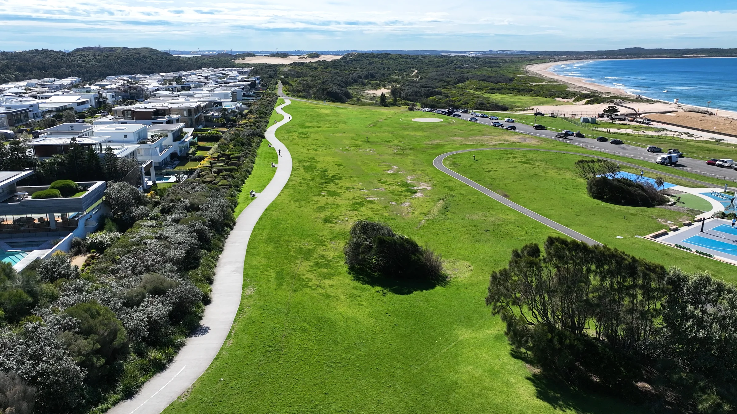 Aerial view of Don Lucas Reserve, its grass, paths, parking and basketball facilities