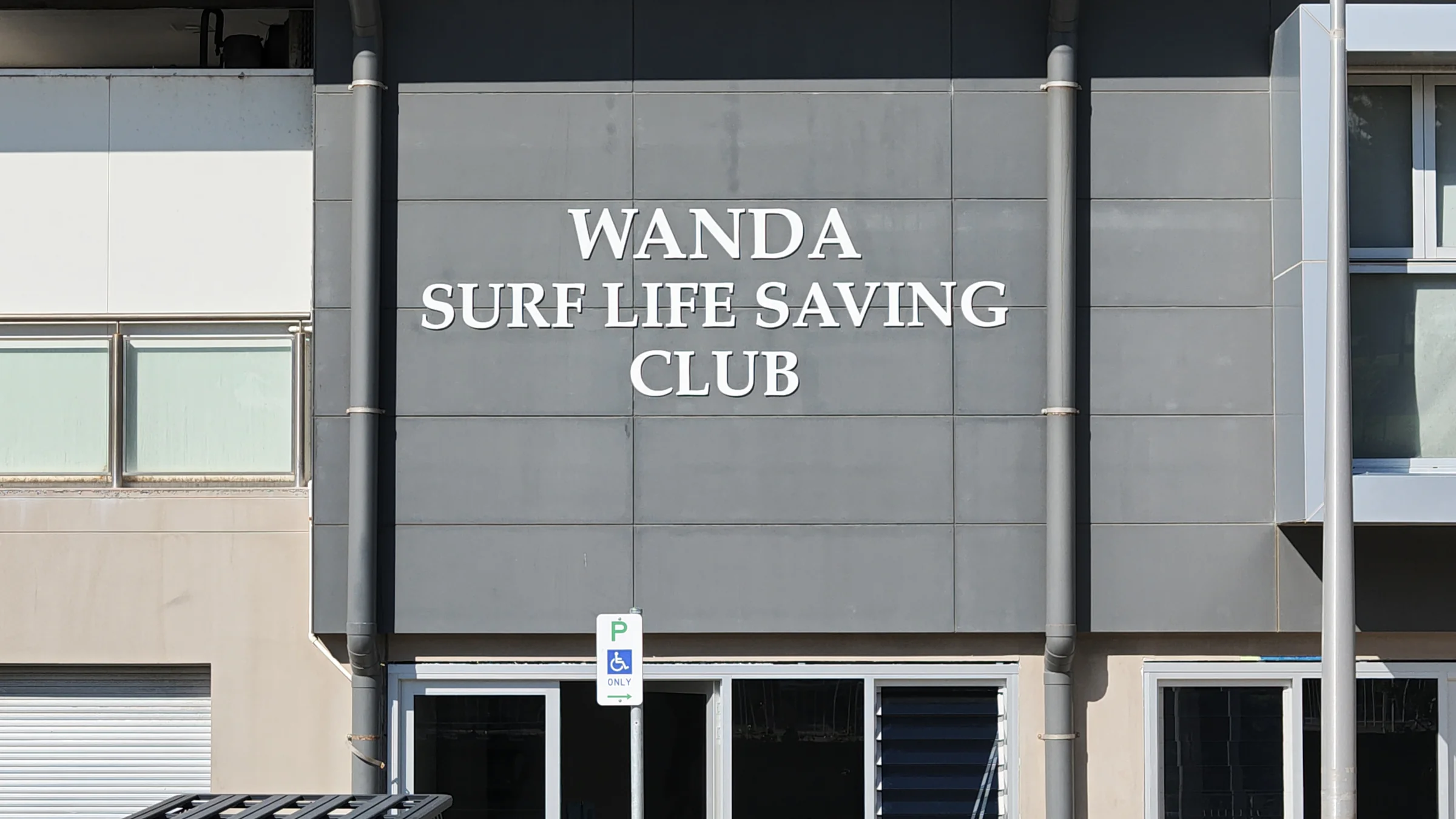 Front of Wanda Surf Life Saving Club with its name on the building